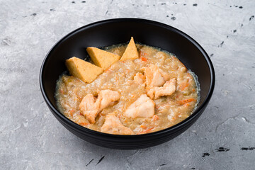 Canvas Print - Braised chicken with tofu, carrots, onions and potatoes.