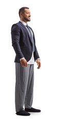 Canvas Print - Full length shot of a man wearing a suit and bottom pajamas