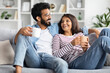 © Prostock-studio - Loving beautiful eastern couple drinking coffee at home