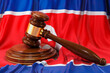 North Korean law and justice concept. Wooden gavel on flag of North Korea, 3D rendering