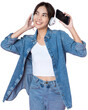 Young Asian woman wearing headphones dancing and listening to music from smartphone shoot in isolated background