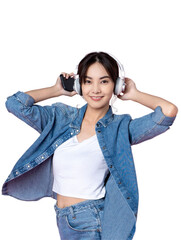 Wall Mural - Young Asian woman wearing headphones dancing and listening to music from smartphone shoot in isolated background