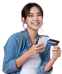 Wall Mural - Young beauty Asian woman shopping payment online with credit card on smartphone and she wearing jean and looking at phone isolated background