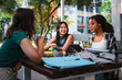 © Pablo Rasero - Three student friends talking to each other while they are studying for an exam.