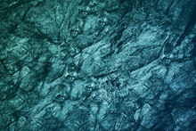 Blue Green Gray Teal Aqua Turquoise Rough Mountain Surface. Close-up. Toned Stone Rock Mineral Granite Texture Background. Cracked, Crumbled. Underwater, Water Or Ice, Frost Effect.Color Gradient.Dark