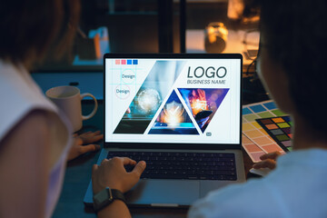 Fototapete - Designer working on the laptop hand using digital pen on monitor screen with editor retouching photos.