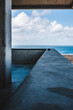© Cavan Images - view from modern concrete building looking out over the ocean