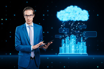 Poster - Network connection, cloud computing and smart city concept with businessman using digital tablet on dark background with glowing blue city buildings under pixel rain and speech bubbles from cloud