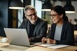 © yj - Happy professional mid aged mature executive manager working in office with female colleague, talking and looking at laptop computer sitting at table workplace. generative AI