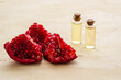 Serum bottle with pomegranate seed oil. Natural cosmetic and treatment product
