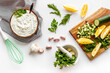 Greek dip sauce ingredients - sour cream with herbs cucumber