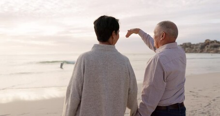 Canvas Print - Senior couple, beach and holding hands outdoor at sunset for love, care and quality time on travel. Behind a man and woman together at ocean for retirement holiday or vacation while talking in nature