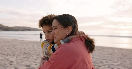 Poster - Beach, mother and child hug outdoor on family vacation, holiday or adventure at sunset. Woman and a boy kid embrace and pointing at ocean for quality time with love, comfort and care in nature