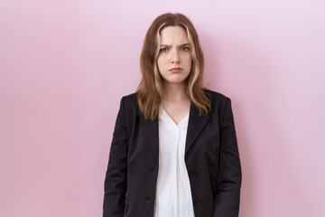 Poster - Young caucasian business woman wearing black jacket skeptic and nervous, frowning upset because of problem. negative person.