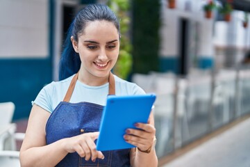 Sticker - Young caucasian woman waitress smiling confident using touchpad at coffee shop terrace