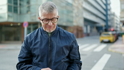 Sticker - Middle age grey-haired man smiling confident standing at street