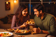 © VisualProduction - Young couple eating indian food at home. Couple on date night with delicious food. Generative AI