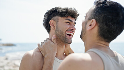 Poster - Two men couple smiling confident touching face at seaside