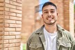 © Krakenimages.com - Young hispanic man smiling confident standing at street