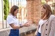 © Krakenimages.com - Mother and daughter smiling confident standing together at street