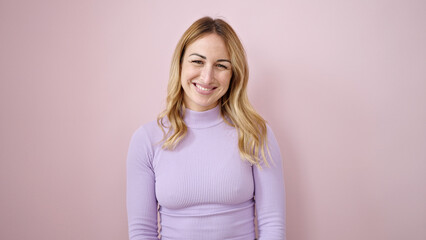 Canvas Print - Young beautiful hispanic woman smiling confident standing over isolated pink background