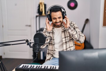 Sticker - Young hispanic man artist singing song at music studio