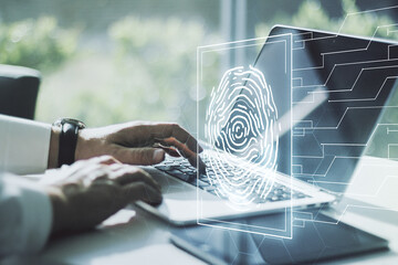 Aufkleber - Multi exposure of creative fingerprint hologram with hands typing on computer keyboard on background, personal biometric data concept