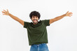 © kucherav - Happy Asian smiling man in green t-shirt and blue jeans standing on white background