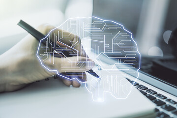 Poster - Double exposure of creative artificial Intelligence symbol with hand writing in notebook on background with laptop. Neural networks and machine learning concept