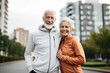 © BrightSpace - Happy senior couple running together in the park, celebrating love, health, and retirement ,Elderly couple's joyful run in the park reflects their love-filled, healthy senior lifestyle,banner,. gen ai