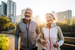 © BrightSpace - Happy senior couple running together in the park, celebrating love, health, and retirement ,Elderly couple's joyful run in the park reflects their love-filled, healthy senior lifestyle,banner,. gen ai