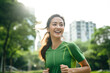 © BrightSpace - Vibrant Midlife Woman Exercising Outdoors: Beautiful Lady portrait people jogging with Freshness in Urban Park with Trees and Buildings with bright sun and nature light, healthy concept, gen ai