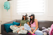 Excited teen girls having fun with virtual reality technology