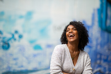 Wall Mural - young african american woman laughing