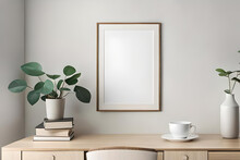Empty Wooden Picture Frame, Poster Mockup Hanging On Beige Wall Background. Vase With Green Eucalyptus Tree Branches On Table. Cup Of Coffee, Books. Working Space, Home Office