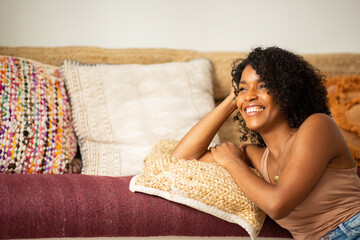 Wall Mural - smiling young woman relaxing at home