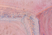 Aerial View Of Fence Line Detail Through A Pink Salt Lake