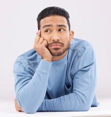 Aufkleber - Thinking, remember and young man in a studio resting on his arms with a contemplating facial expression. Happy, smile and Indian male model with question or dreaming face isolated by white background