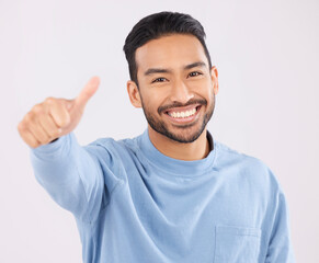 Canvas Print - Portrait, smile and asian man in studio with thumbs up, hand or thank you sign on grey background. Happy, face and Japanese male with finger emoji for yes, vote or positive review, success or agree