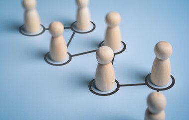 Social gathering and networking connections by lines with figurines. Cooperation creates a new team and links contacts communication in group. Relationship, connection, and contact between people.