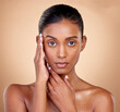 © Nadia L/peopleimages.com - Portrait, makeup and Indian woman with cosmetics, dermatology and wellness against a brown studio background. Face, female person and model with health, luxury and aesthetic with self care and beauty