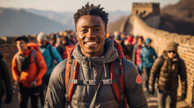 Young African American Tourist Man With Backpack On Great Wall Of China. Generative AI.