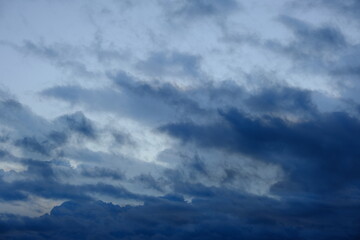 Wall Mural - Clearing sky after rain.Natura background, clouds at sunset.