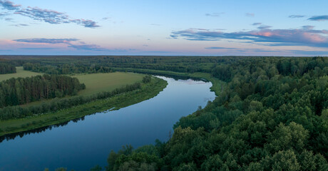 Aufkleber - Aerial panoramic landscape with sunset over the river with islands and beautiful clouds on the sky.
