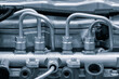 © Aleksandr Matveev - Blue diesel engine. Fragment of a diesel motor close-up. Selective on the fuel injection in the the diesel engine. supply system for diesel fuel.  Engine details  Diesel engine  background