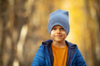 © Irina Mikhailichenko - Close up autumn portrait of a cute little boy in autumn park. Preschooler child in fall forest. Bokeh. Selective focus