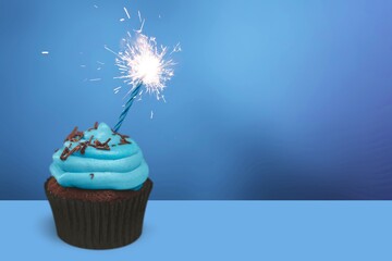 Poster - Tasty sweet cupcake with sprinkles and sparkler