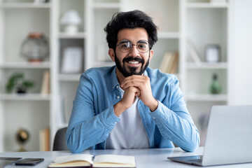 Aufkleber - Portrait Of Positive Indian Freelancer Man Sitting At Desk In Home Office