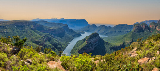 panorama shot of the blyde river canyon, dam and the mountains with lush foliage, panorama route, gr