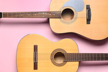 Acoustic Guitars On Color Background, Top View
